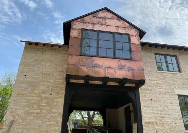 Copper metal panel facade on a stone building for Skylight Installation in Readington